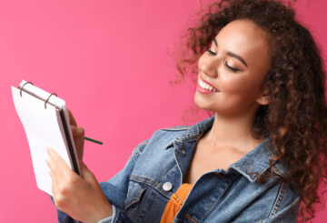 woman looking at a notepad